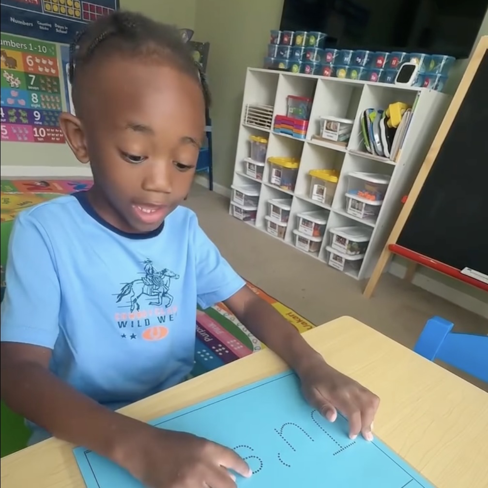 Children participating in a classroom activity at Lovin2Learn Christian Academy